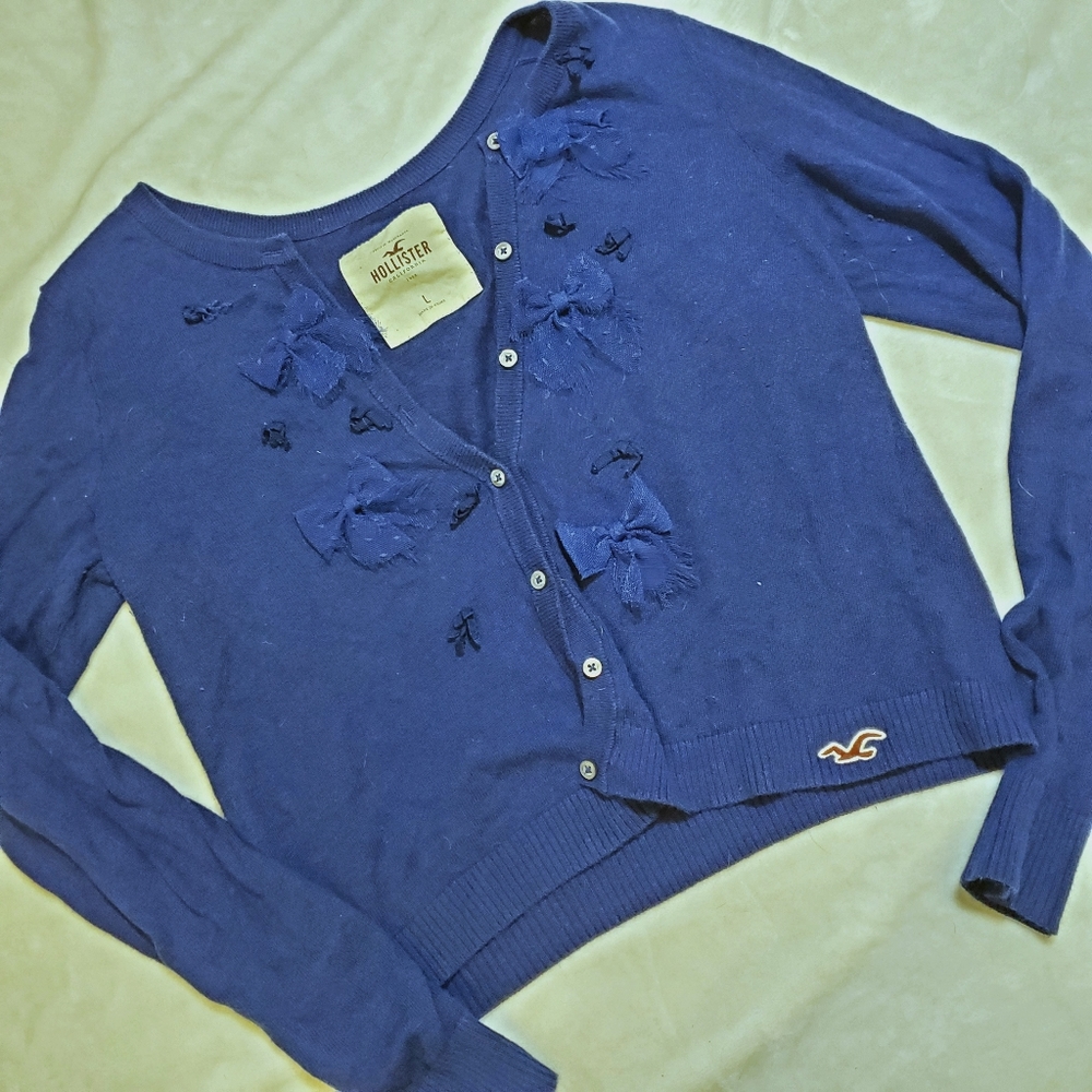 Blue Hollister cardigan with bows